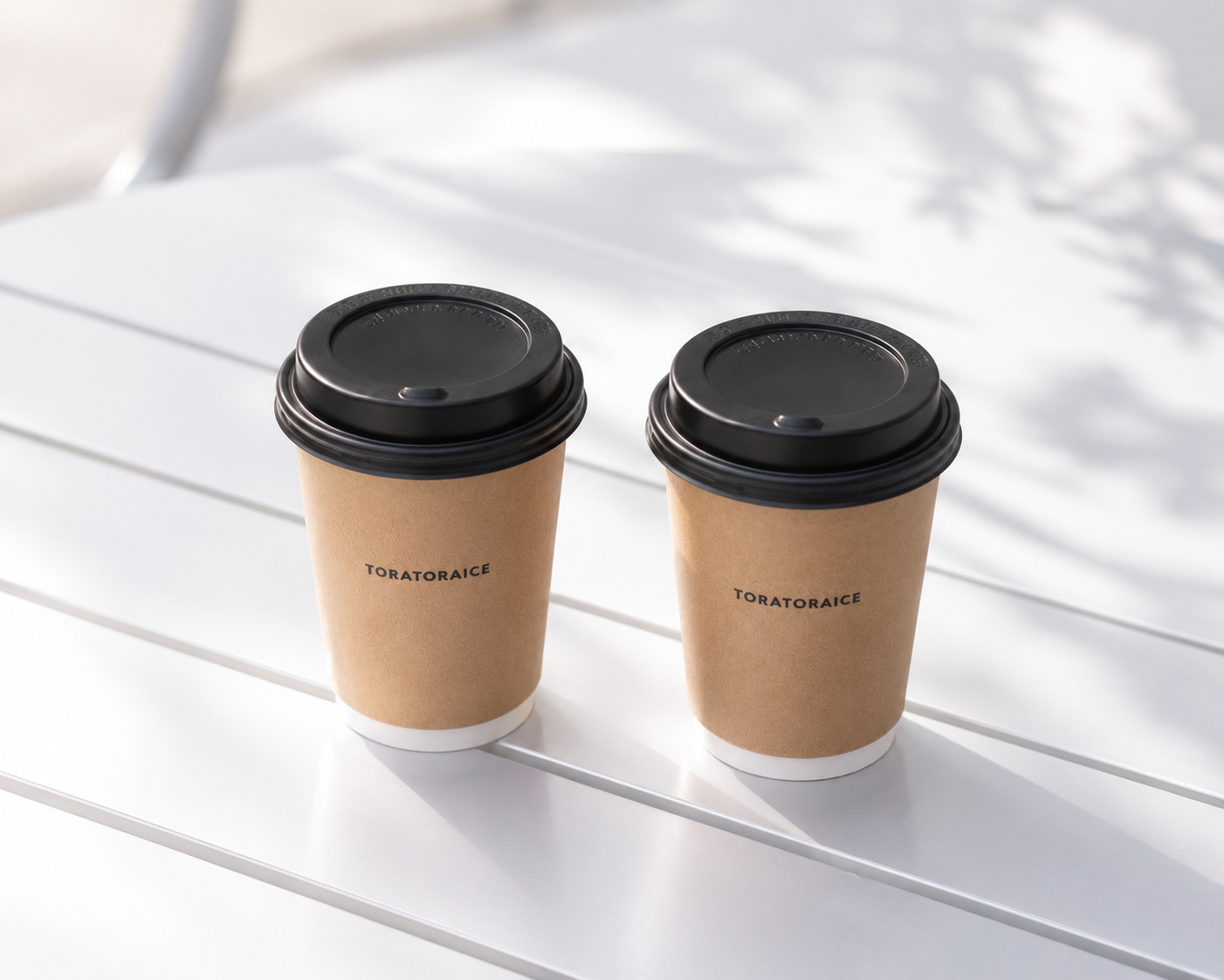 Two TORATORAICE takeaway cups